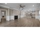 Open-concept living space with a fireplace, recessed lighting, and views into the adjacent kitchen at 721 Sage Oak Ln, Holly Springs, NC 27540