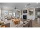 Well-appointed living room features modern decor, a fireplace, and plenty of space for relaxing and entertaining at 721 Sage Oak Ln, Holly Springs, NC 27540