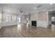 Bright open living room features a fireplace and sliding doors that lead to an outdoor area at 721 Sage Oak Ln, Holly Springs, NC 27540