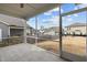 Screened patio overlooking backyard featuring an open-air view of neighborhood at 721 Sage Oak Ln, Holly Springs, NC 27540