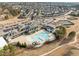 Aerial shot of a community pool area featuring a large pool, lounge chairs, and surrounding amenities at 721 Sage Oak Ln, Holly Springs, NC 27540