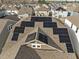Aerial view of a roof adorned with solar panels amidst a neighborhood setting at 721 Sage Oak Ln, Holly Springs, NC 27540