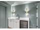 Stylish wet bar featuring white cabinetry, wine cooler, and quartz countertops at 7217 Manor Oaks Dr, Raleigh, NC 27615