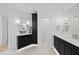 Luxurious bathroom boasting dual vanities, sleek black cabinetry, and elegant fixtures at 7217 Manor Oaks Dr, Raleigh, NC 27615