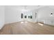 Spacious bedroom with hardwood floors, light walls, and a ceiling fan at 7217 Manor Oaks Dr, Raleigh, NC 27615