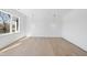 Bright bedroom featuring hardwood floors and modern pendant lighting at 7217 Manor Oaks Dr, Raleigh, NC 27615