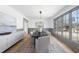 Formal dining room featuring contemporary decor, natural light, and wood floors at 7217 Manor Oaks Dr, Raleigh, NC 27615