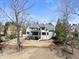 Aerial view of the home featuring a spacious backyard, deck, and mature trees at 7217 Manor Oaks Dr, Raleigh, NC 27615