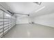 Spacious garage with epoxy flooring, ample lighting, and an insulated garage door at 7217 Manor Oaks Dr, Raleigh, NC 27615