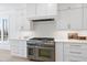 Modern gourmet kitchen with stainless steel appliances, granite countertops, and custom cabinetry at 7217 Manor Oaks Dr, Raleigh, NC 27615