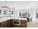 Large kitchen with island, countertops, modern appliances, and hardwood floors looking to dining area at 7217 Manor Oaks Dr, Raleigh, NC 27615