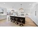 Large kitchen with island, countertops, modern appliances, and hardwood floors at 7217 Manor Oaks Dr, Raleigh, NC 27615