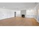 Living room showcasing a modern fireplace, built-in cabinets, and ample natural light at 7217 Manor Oaks Dr, Raleigh, NC 27615