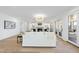 Bright, open living room with fireplace and french doors with outdoor access and views at 7217 Manor Oaks Dr, Raleigh, NC 27615