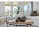 Close up of an stylishly decorated living room coffee table with vase and decorative chain at 7217 Manor Oaks Dr, Raleigh, NC 27615