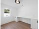 Bright office space with built-in desk, storage, and a window providing natural light at 7217 Manor Oaks Dr, Raleigh, NC 27615