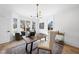 Bright and airy home office with a comfortable sitting area and views of the surrounding neighborhood at 7217 Manor Oaks Dr, Raleigh, NC 27615