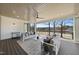 Inviting covered patio with comfortable seating, ceiling fan, and peaceful lake views, perfect for relaxing at 7217 Manor Oaks Dr, Raleigh, NC 27615