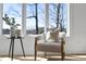 Close-up of the sitting area showcasing a modern chair, table, and bright natural light at 7217 Manor Oaks Dr, Raleigh, NC 27615