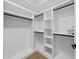 Spacious walk-in closet with custom shelving and ample storage space at 7217 Manor Oaks Dr, Raleigh, NC 27615