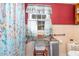 Small bathroom with colorful nautical-themed decorations and basic amenities at 7534 Overhills Rd, Spring Lake, NC 28390