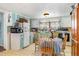 Eat-in kitchen with a small dining table and modest appliances at 7534 Overhills Rd, Spring Lake, NC 28390