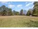 Expansive lot perfect for building or recreation, with mature trees providing shade and privacy at 7534 Overhills Rd, Spring Lake, NC 28390