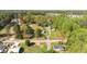Beautiful wooded land outlined in red on a desirable lot near surrounding houses and mature trees at 7534 Overhills Rd, Spring Lake, NC 28390