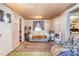 Cozy living room featuring a comfortable couch and vintage decor at 7534 Overhills Rd, Spring Lake, NC 28390