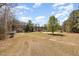 Vast lot showcasing multiple structures, offering a glimpse of the property's scale and potential at 7534 Overhills Rd, Spring Lake, NC 28390
