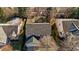 Aerial view of home showcasing the roof, landscaping, and the backyard firepit at 778 Cabin Branch Dr, Fuquay Varina, NC 27526