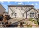Spacious backyard patio featuring a textured stone surface and ample space for outdoor living at 778 Cabin Branch Dr, Fuquay Varina, NC 27526