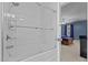 Bathroom with a shower and glass door, leading to a bedroom with blue walls at 778 Cabin Branch Dr, Fuquay Varina, NC 27526