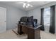 Bedroom with a large window and a desk with dual monitors and a ceiling fan at 778 Cabin Branch Dr, Fuquay Varina, NC 27526