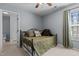 Cozy bedroom features natural light and neutral carpet at 778 Cabin Branch Dr, Fuquay Varina, NC 27526