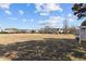 Expansive community green space surrounded by houses, perfect for outdoor activities at 778 Cabin Branch Dr, Fuquay Varina, NC 27526