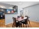 Cozy dining room with hardwood floors, adjacent to kitchen and an outside door at 778 Cabin Branch Dr, Fuquay Varina, NC 27526