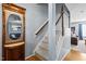 Inviting foyer featuring a staircase, hardwood floors, and decorative mirror at 778 Cabin Branch Dr, Fuquay Varina, NC 27526