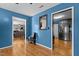 Hallway view leads to the living room and kitchen, showcasing modern flooring at 778 Cabin Branch Dr, Fuquay Varina, NC 27526