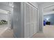 Hallway featuring a closet with white doors and entryways to other rooms at 778 Cabin Branch Dr, Fuquay Varina, NC 27526
