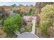 Stunning aerial view of the home showcasing its beautiful landscaping, circular driveway, and lush surroundings at 8 Bryncastle Ct, Durham, NC 27707