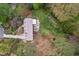 Overhead shot of the backyard showcasing the deck, hot tub, garden, and lush landscaping of the property at 8 Bryncastle Ct, Durham, NC 27707