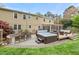 Backyard with a hot tub, seating, fire pit, and lush landscaping creates a relaxing and inviting outdoor space at 8 Bryncastle Ct, Durham, NC 27707