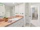 Traditional bathroom featuring a single sink vanity and shower at 8 Bryncastle Ct, Durham, NC 27707