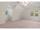 Carpeted bedroom offering abundant natural light at 8 Bryncastle Ct, Durham, NC 27707