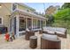 Spacious backyard deck featuring outdoor seating and string lights for a cozy evening ambiance at 8 Bryncastle Ct, Durham, NC 27707