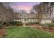Charming single-Gathering home featuring manicured lawn, dormer windows, symmetrical design and an attached garage at 8 Bryncastle Ct, Durham, NC 27707