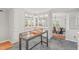 Bright, open kitchen with a center island, ample cabinet space, and views into the dining area at 8 Bryncastle Ct, Durham, NC 27707