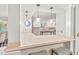 Stylish kitchen featuring pendant lighting, a tiled breakfast bar, and views into the kitchen at 8 Bryncastle Ct, Durham, NC 27707