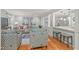 Open-concept living area with hardwood floors, stylish furnishings, and seamless flow to the kitchen at 8 Bryncastle Ct, Durham, NC 27707